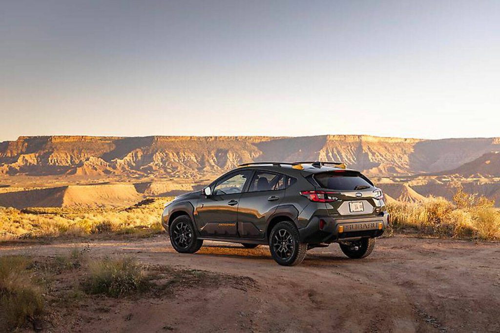 Prominent badging and anodized copper-finish accents are exterior features of the 2024 Subaru Crosstrek Wilderness small SUV. (Subaru)