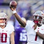 Washington State quarterback Cameron Ward (1) throws during warmups before an NCAA college football game against Washington, Saturday, Nov. 25, 2023, in Seattle. (AP Photo/Lindsey Wasson)