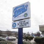 A sign in front of the AquaSox front office references the upcoming Everett City Council vote on a sum of $1.1 million to give to outside contractors to help upgrade a new stadium on Wednesday, Nov. 29, 2023 in Everett, Washington. (Olivia Vanni / The Herald)