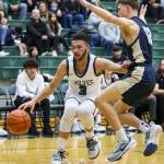 Jacksons Trey Hawkins tries to maneuver around Arlingtons Kaid Hunter during the game on Tuesday, Nov. 28, 2023 in Everett, Washington. (Olivia Vanni / The Herald)