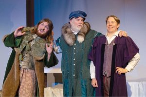 Collius_boys.jpg: Carolea’s father Collius (Jay Jenkins, center) has selected Ambrosius (Ian Wight, right) as his choice for his daughter, but she is in love with Nectarean (Josias Allestad) in Red Curtain’s production of “A MidWinter Night’s Dream,” Dec. 1-23.