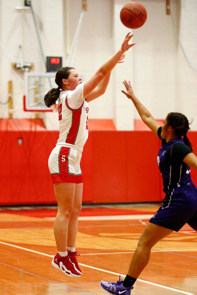 Stanwoods Jazmyn Legg takes a deep shot against Kamiak on Thursday, Nov. 30, 2023, at Stanwood High School in Stanwood, Washington. (Ryan Berry / The Herald)