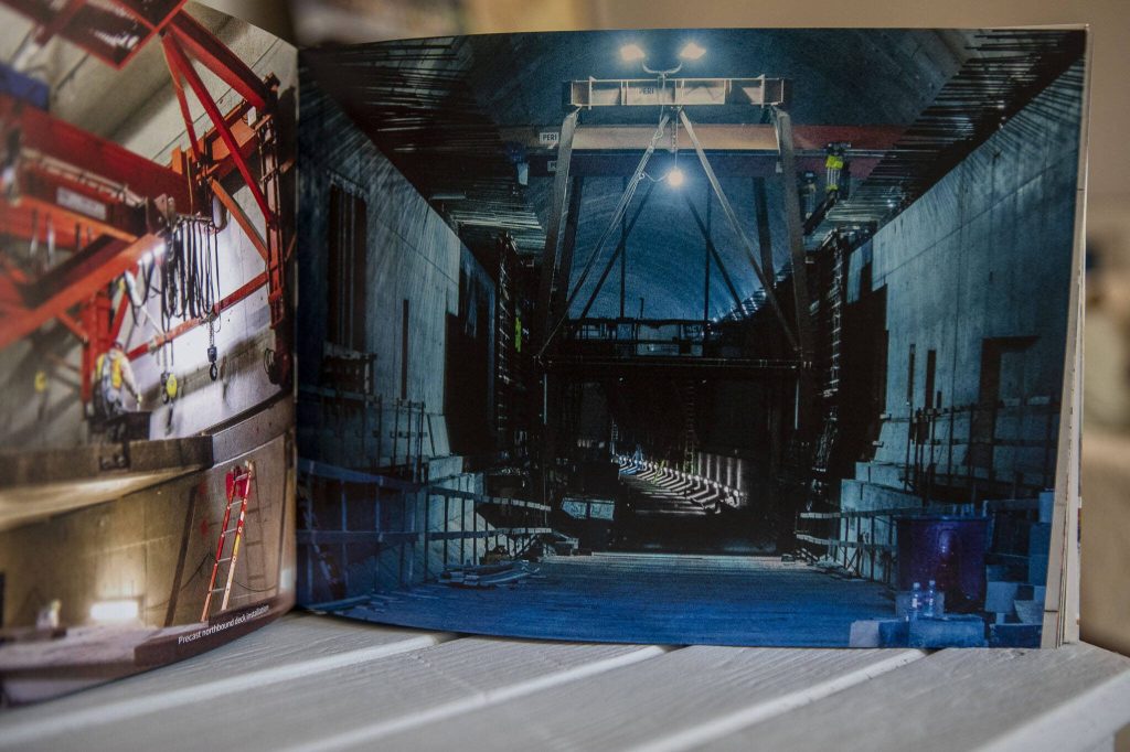 An image from Catherine Bassettis book Building Seattles State Route 99 Supertunnel: Journey from Light to Light in her home studio in Shoreline, Washington on Friday, May 19, 2023. (Annie Barker / The Herald)