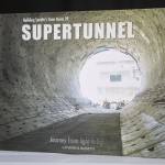 Catherine Bassettis book Building Seattles State Route 99 Supertunnel: Journey from Light to Light in her home studio in Shoreline, Washington on Friday, May 19, 2023. (Annie Barker / The Herald)
