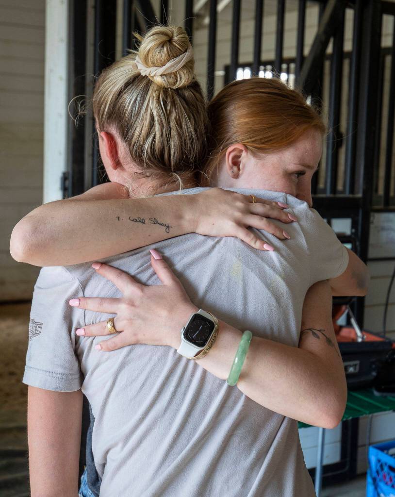 Kaisa and Shay Daniels hug and celebrate after learning Manny will survive at the Gifford Horses barn in Snohomish, Washington on Friday, June 23, 2023. (Annie Barker / The Herald)