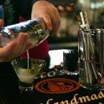 Bartender Hunter Haynes pours a dirty martini while working at Coles Tavern. (Ryan Berry / The Herald)