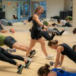 Instructor Gael Gebow walks amongst her class and yells to keep up motivation during her Boot Camp fitness class Monday, Nov. 13, 2023, at the YMCA in Everett, Washington. (Ryan Berry / The Herald)