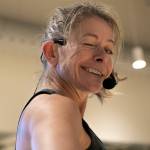 Instructor Gael Gebow turns and gives the camera a wink during her Boot Camp fitness class Monday, Nov. 13, 2023, at the YMCA in Everett, Washington. (Ryan Berry / The Herald)