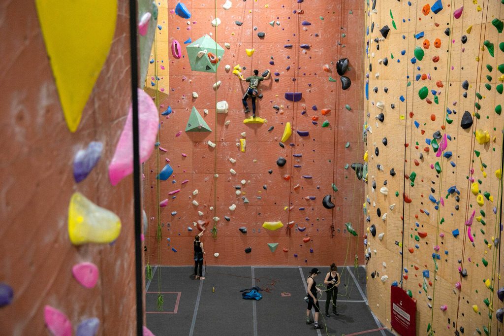 Climbers take on a wall at Vertical World North on Monday, Nov. 20, 2023, in Lynnwood, Washington. (Ryan Berry / The Herald)