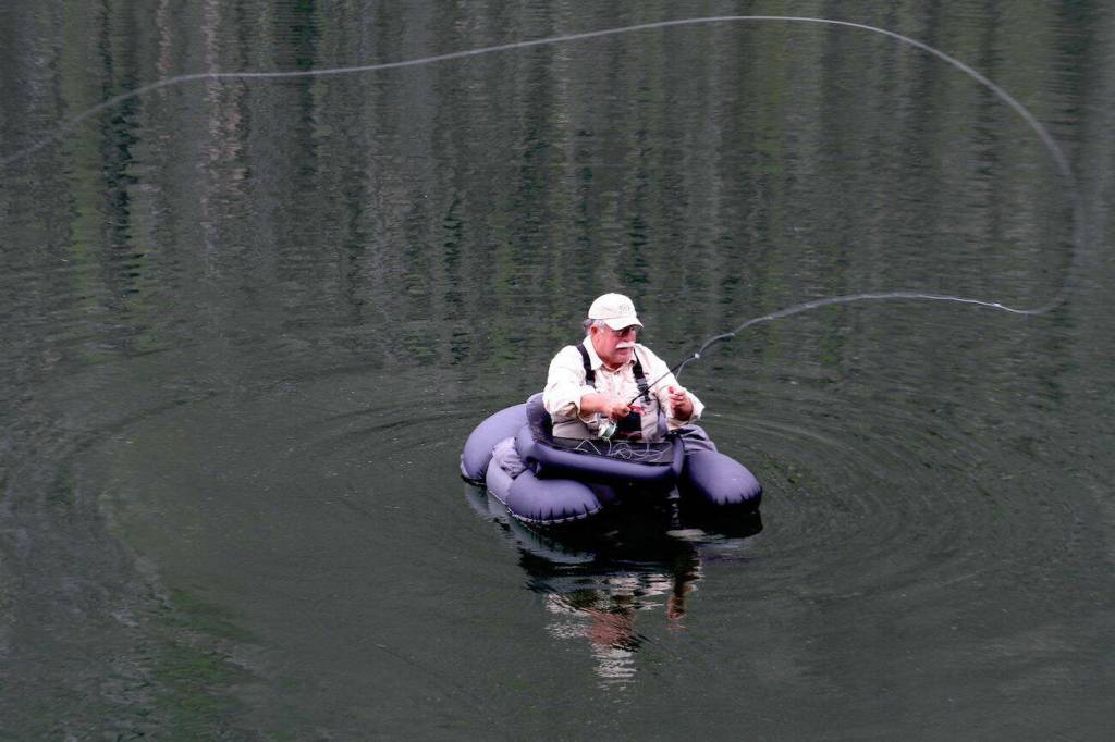 Mike Benbow, of Tulalip, uses a float tube to search for trout in Black Lake north of Winthrop in the Pasayten Wilderness at about 4,000 ft on July 20, 2012. Float tubes allow access to more water on the high mountain lakes. (Jim Haley / The Herald)