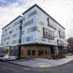 Outside of Compass Healths Andys Place residence next to the Broadway construction site of Compass Healths new mental health facility on Wednesday, Nov. 29, 2023 in Everett, Washington. (Olivia Vanni / The Herald)