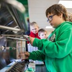 Darrington Elementary School fourth grader Brayden Parris, 9, fills up his cup with chocolate milk from one of the schools new milk dispenser during lunch on Monday, Nov. 20, 2023 in Darrington, Washington. (Olivia Vanni / The Herald)