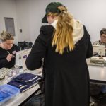 Kelly Leahy, left, and Cindy Parker, right, work on sewing and sticking items brought in for repairs at the Repair Cafe on Saturday, Nov. 18, 2023 in Mountlake Terrace, Washington. (Olivia Vanni / The Herald)