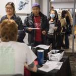 Dozens of people wait in line with items in need of repair at the Repair Cafe on Saturday, Nov. 18, 2023 in Mountlake Terrace, Washington. (Olivia Vanni / The Herald)