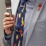 Health Department Director Dennis Worsham wears a condom-themed tie at a press conference held in celebration of the STI clinic opening on Friday, Dec. 1, 2023 in Everett, Washington. (Olivia Vanni / The Herald)