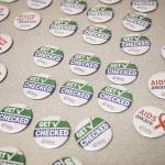 Buttons with STI related slogans at a press conference held in celebration of the STI clinic opening on Friday, Dec. 1, 2023 in Everett, Washington. (Olivia Vanni / The Herald)