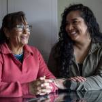 Elizabeth Cervantes, right, and her mother Maria Jimenez, left, pose for a photo at their home in Burlington, Washington on Wednesday, Dec. 6, 2023.  (Annie Barker / The Herald)