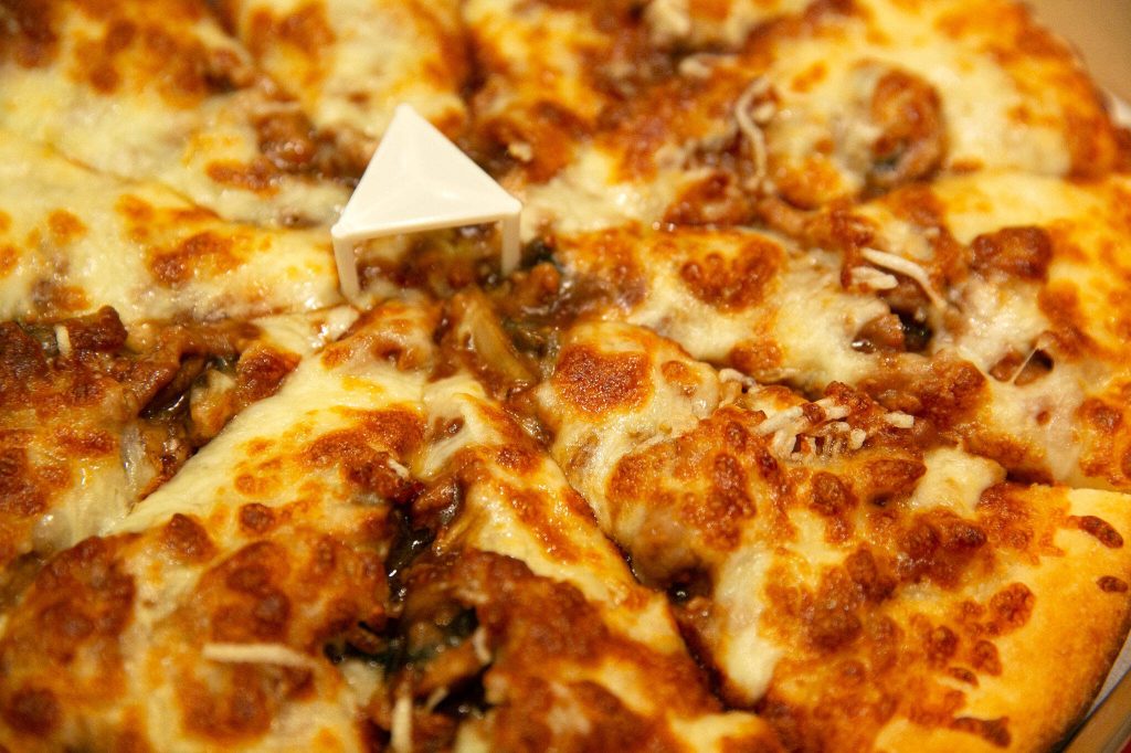 Ghengis Khan Pizza at Pedeltweezers Chinese and Pizza on Wednesday, Dec. 6, 2023, in Arlington, Washington. (Ryan Berry / The Herald)