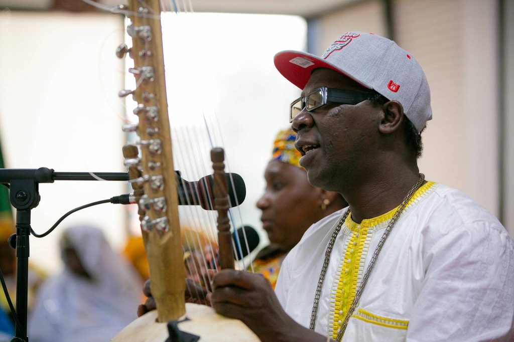 Musician Pa Bobo Jobarteh plays the kora and sings during the grand opening of the Washington West African Center on Saturday, Dec. 2, 2023, in Lynnwood, Washington. (Ryan Berry / The Herald)