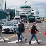Offloading ferry traffic is stopped to allow pedestrians to cross the street at the Edmonds ferry dock on Friday, Sept. 21, 2018, in Edmonds. (Andy Bronson / The Herald)