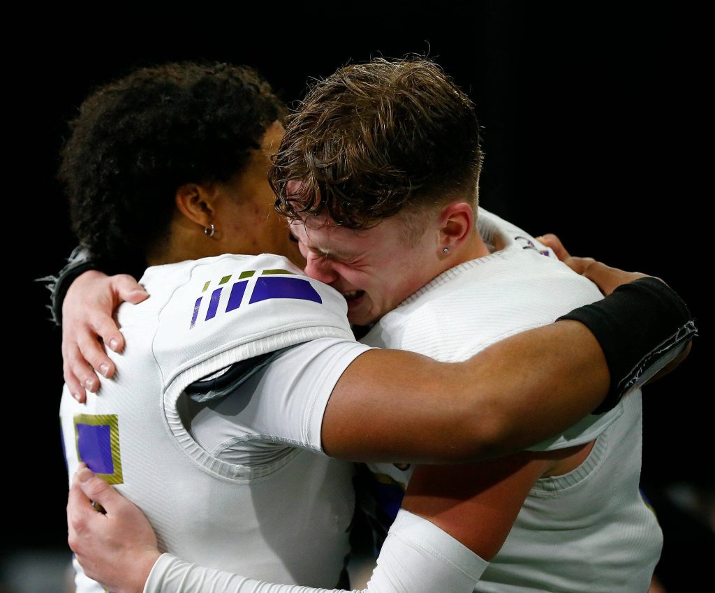 Lake Stevens players begin to celebrate after their victory over Graham-Kapowsin during the WIAA 4A Football State Championship on Saturday, Dec. 2, 2023, at Husky Stadium in Seattle, Washington. (Ryan Berry / The Herald)