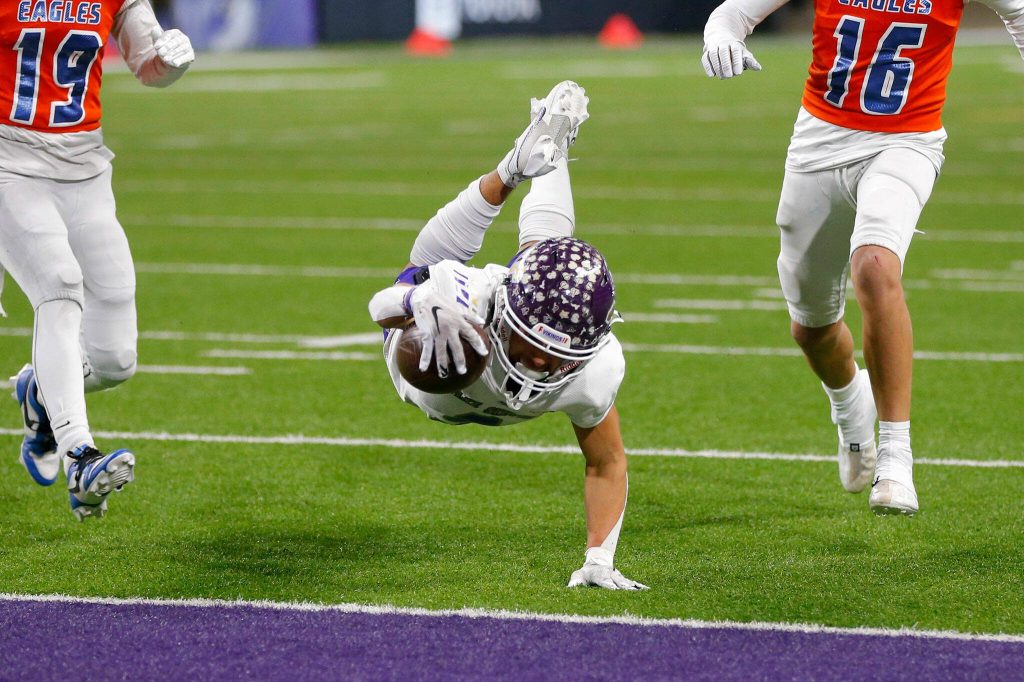 Lake Stevens senior receiver Paul Varela dives into the end zone after snagging a deep pass from quarterback Kolton Matson against Graham-Kapowsin during the WIAA 4A Football State Championship on Saturday, Dec. 2, 2023, at Husky Stadium in Seattle, Washington. (Ryan Berry / The Herald)