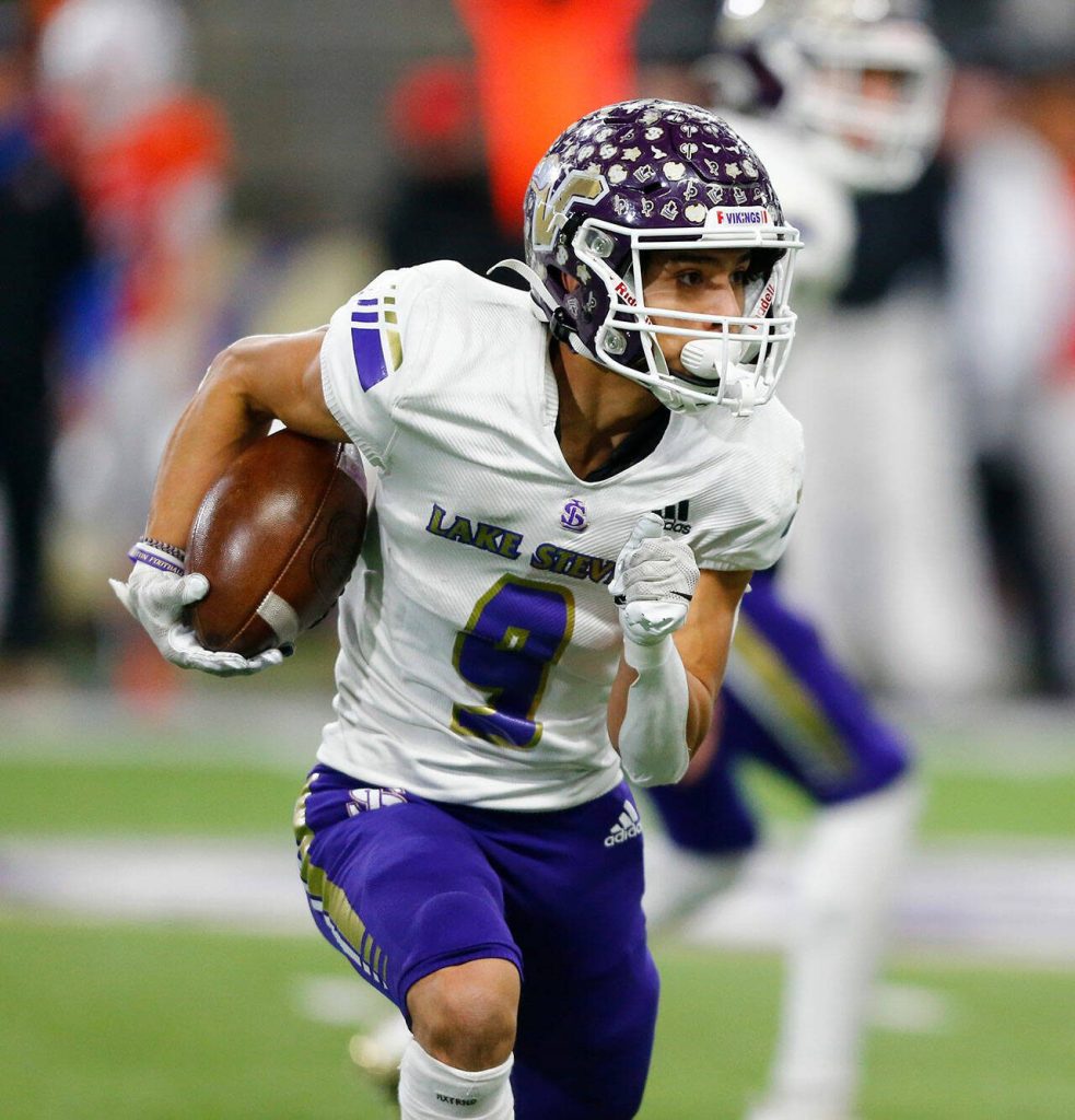 Lake Stevens Paul Varela takes a handoff and looks for space against Graham-Kapowsin during the WIAA 4A Football State Championship on Saturday, Dec. 2, 2023, at Husky Stadium in Seattle, Washington. (Ryan Berry / The Herald)