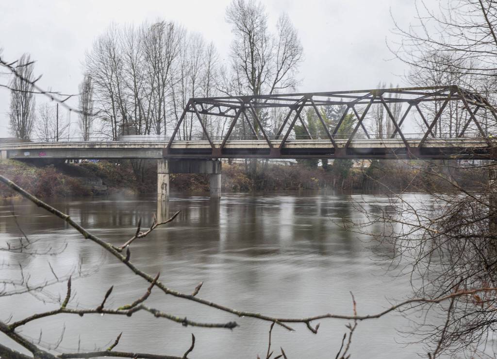 The Snohomish River flows underneath the Airport Way bridge on Monday, Dec. 4, 2023 in Snohomish, Washington. (Olivia Vanni / The Herald)
