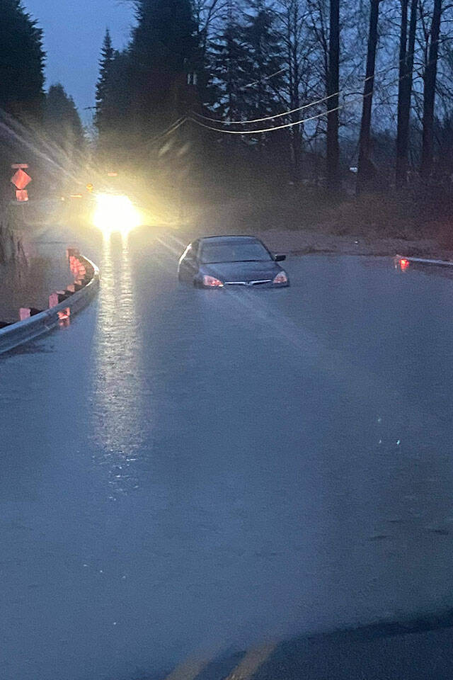 A driver was safely rescued by the Snohomish County Sheriff's Office on Tuesday morning after driving into a flooded roadway in Granite Falls, Washington. (Snohomish County Sheriff's Office)
