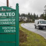 Traffic moves along Mukilteo Speedway in front of Olympic Middle School on Thursday, Dec. 7, 2023 in Everett, Washington. (Olivia Vanni / The Herald)