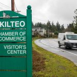 Traffic moves along Mukilteo Speedway in front of Olympic Middle School on Thursday, Dec. 7, 2023 in Everett, Washington. (Olivia Vanni / The Herald)