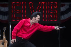 Danny Vernon, Illusion of Elvis Presley tribute impersonator, lets the audience participate as he performs at the Evergreen State Fair on Monday, Aug. 30, 2021 in Monroe, Washington.  (Andy Bronson / The Herald)