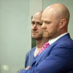 Joseph David Emerson, left, 44, was arraigned in Multnomah County Circuit Court on Oct. 24, 2023, in Portland, Oregon. Emerson, a pilot, is accused of attempting to disable the engines of a plane on which he was riding while off-duty. Emerson pleaded not guilty. (Dave Killen/The Oregonian via AP, Pool)