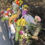 Flowers and notes are left on the bench Henry King frequented after he was killed on March 12, 2023 in Bellingham, Washington. On Wednesday, Dec. 6, 9 months after Kings death, police from Bellingham and Marysville as well as Snohomish County sheriffs deputies arrested Elijah Belmont in Kings killing. (Photo provided by Kyle Peterson)