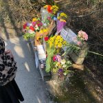 Flowers and notes are left on the bench Henry King frequented after he was killed on March 12, 2023 in Bellingham, Washington. On Wednesday, Dec. 6, 9 months after Kings death, police from Bellingham and Marysville as well as Snohomish County sheriffs deputies arrested Elijah Belmont in Kings killing. (Photo provided by Kyle Peterson)