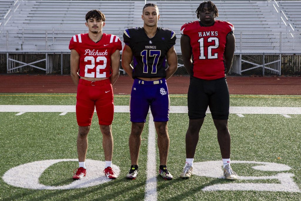 Left to right, Joseph Davis (22), Jayshon Limar (17), and Zaveon Jones (12) on Dec. 17 at Lake Stevens High School. (Annie Barker / The Herald)