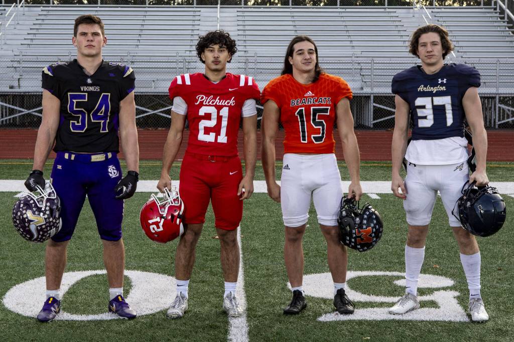 Left to right, Mason Turner (54), Kenai Sinaphet (21), Nick Mouser (15), and Kobi Spady (37) on Dec. 17 at Lake Stevens High School. (Annie Barker / The Herald)