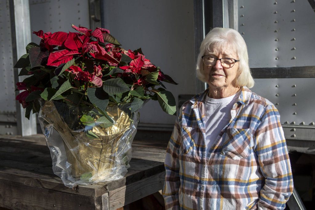 Mildred Brown poses for a photo at the Community Food Bank in Darrington, Washington on Tuesday, Dec. 12, 2023. (Annie Barker / The Herald)
