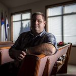 Tim Ziesemer poses for a photo at Glad Tidings Church in Darrington, Washington on Tuesday, Dec. 12, 2023.  (Annie Barker / The Herald)