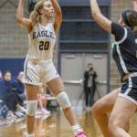 Arlingtons Samara Morrow jumps to make a pass during the game against Lynnwood on Monday, Dec. 11, 2023 in Arlington, Washington. (Olivia Vanni / The Herald)