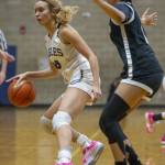 Arlingtons Samara Morrow tries to maneuver around a Lynnwood player during the game on Monday, Dec. 11, 2023 in Arlington, Washington. (Olivia Vanni / The Herald)