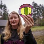 Mackensie Bennett holds a piece that reminds some people of the Eye of Sauron, and others of an alligator. (Photo by David Welton)
