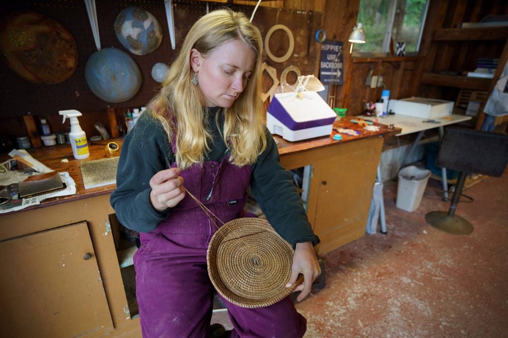 Besides stained glass pieces, Mackensie Bennett also weaves baskets from pine needles. (Photo by David Welton)