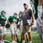 Edmonds-Woodway coach John Gradwohl, wearing his signature khaki shorts, talks to players during practice on Aug. 24, 2018, in Edmonds. (Olivia Vanni / The Herald)
