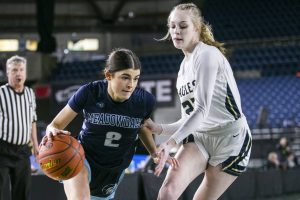 Meadowdale’s Gia Powel drives to the hoop during the 3A quarterfinal game against Arlington on Thursday, March 2, 2023 in Tacoma, Washington. (Olivia Vanni / The Herald)