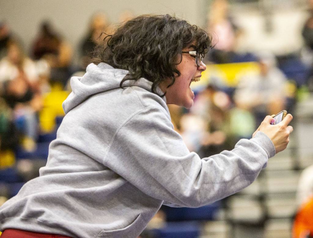 A Cascade wrestler cheers on their teammate on Wednesday, Dec. 13, 2023 in Everett, Washington. (Olivia Vanni / The Herald)