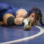 Arlingtons Danielle Crew looks forward while trying to pin her opponent on Wednesday, Dec. 13, 2023 in Everett, Washington. (Olivia Vanni / The Herald)