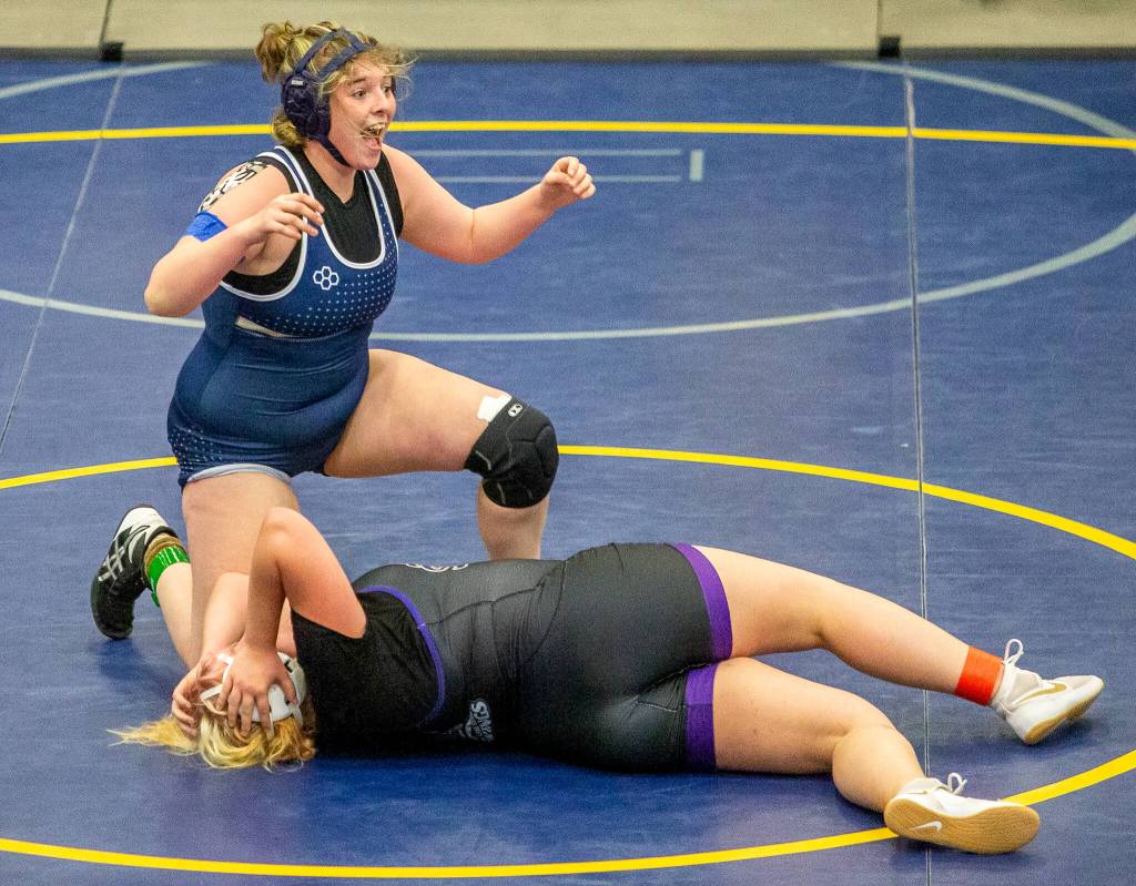 Arlington’s Katie Wheeler reacts to beating Lake Steven’s Anna Cappel on Wednesday, Dec. 13, 2023 in Everett, Washington. (Olivia Vanni / The Herald)