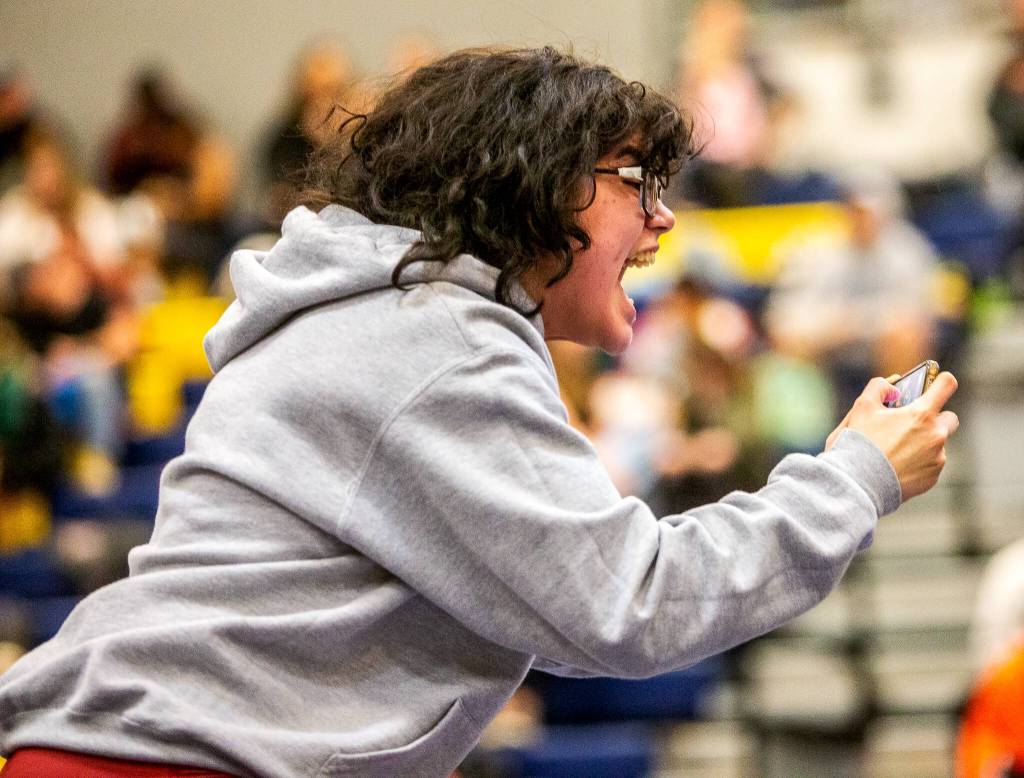 A Cascade wrestler cheers on their teammate on Wednesday, Dec. 13, 2023 in Everett, Washington. (Olivia Vanni / The Herald)