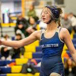 Arlington’s Araxi Crew goes to shake the hand of her opponent on Wednesday, Dec. 13, 2023 in Everett, Washington. (Olivia Vanni / The Herald)